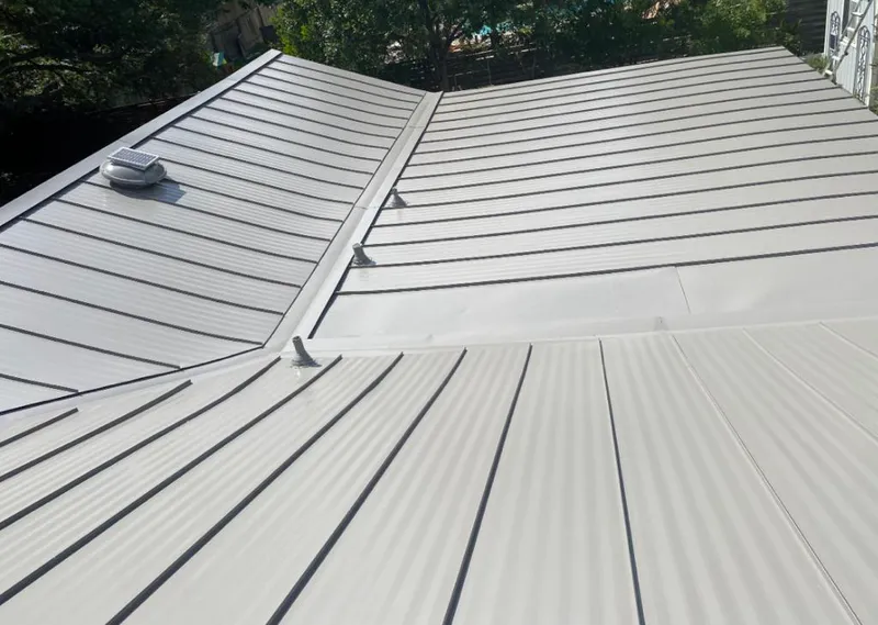 Solar attic fan installed on a metal roof for Roof Ventilation in University of California-Santa Barbara